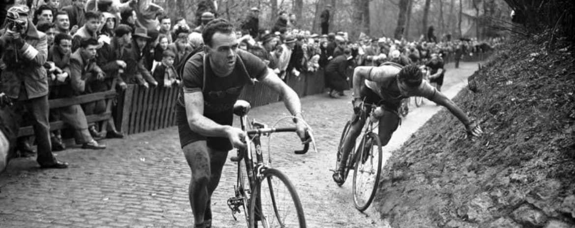 Retro picture of pro riders struggling on De Muur van Geraardsbergen