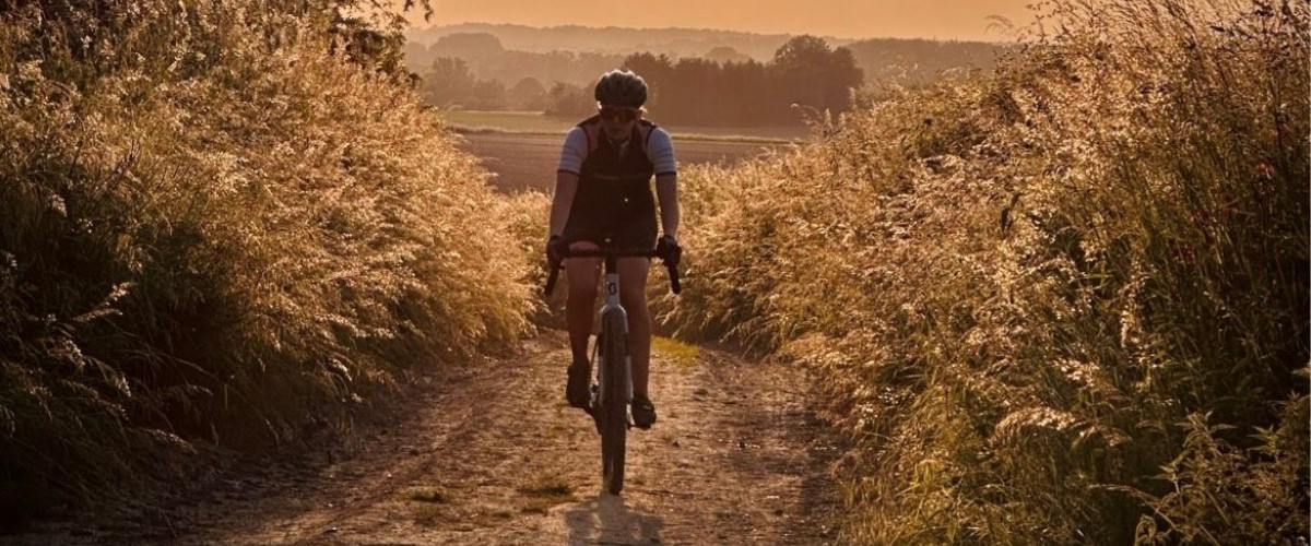 Gravel cyclist at sunset